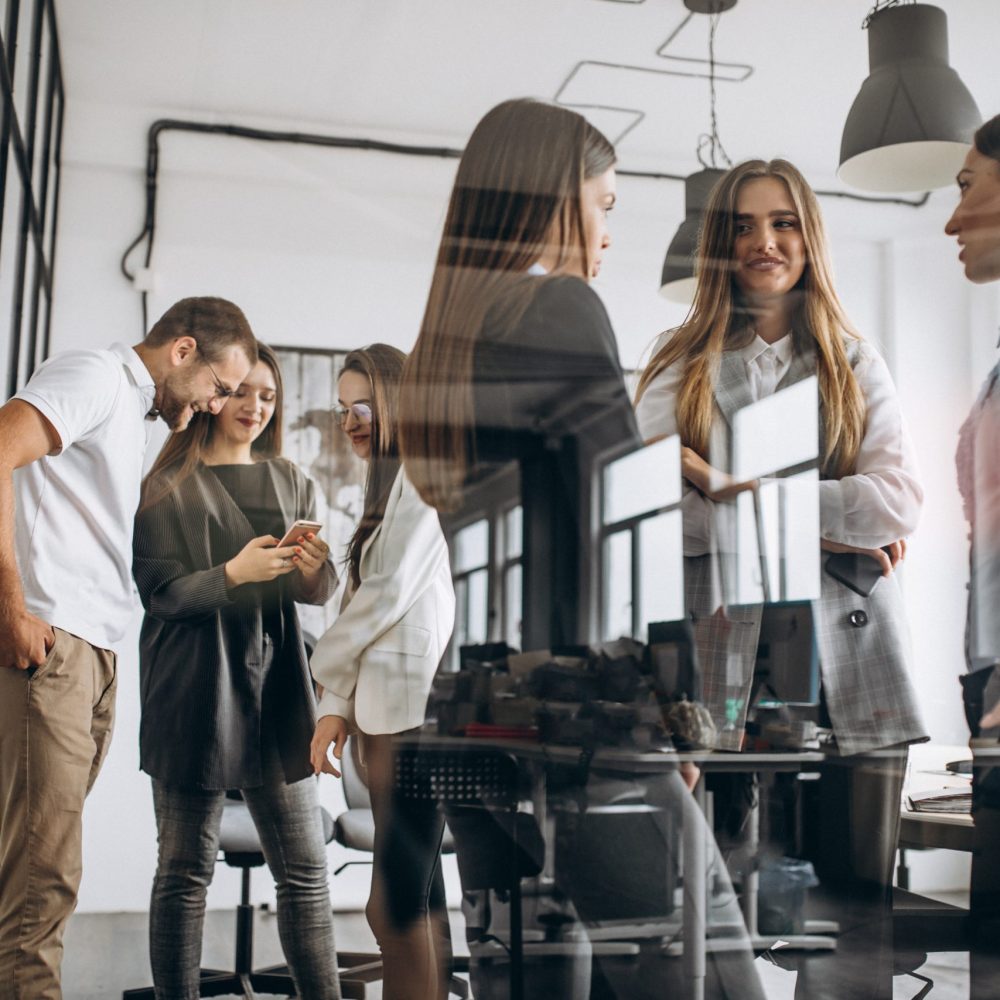 Group of people working out business plan in an office Group of people working out business plan in an office